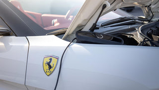 CTEK CS ONE battery charger connected to a Ferrari